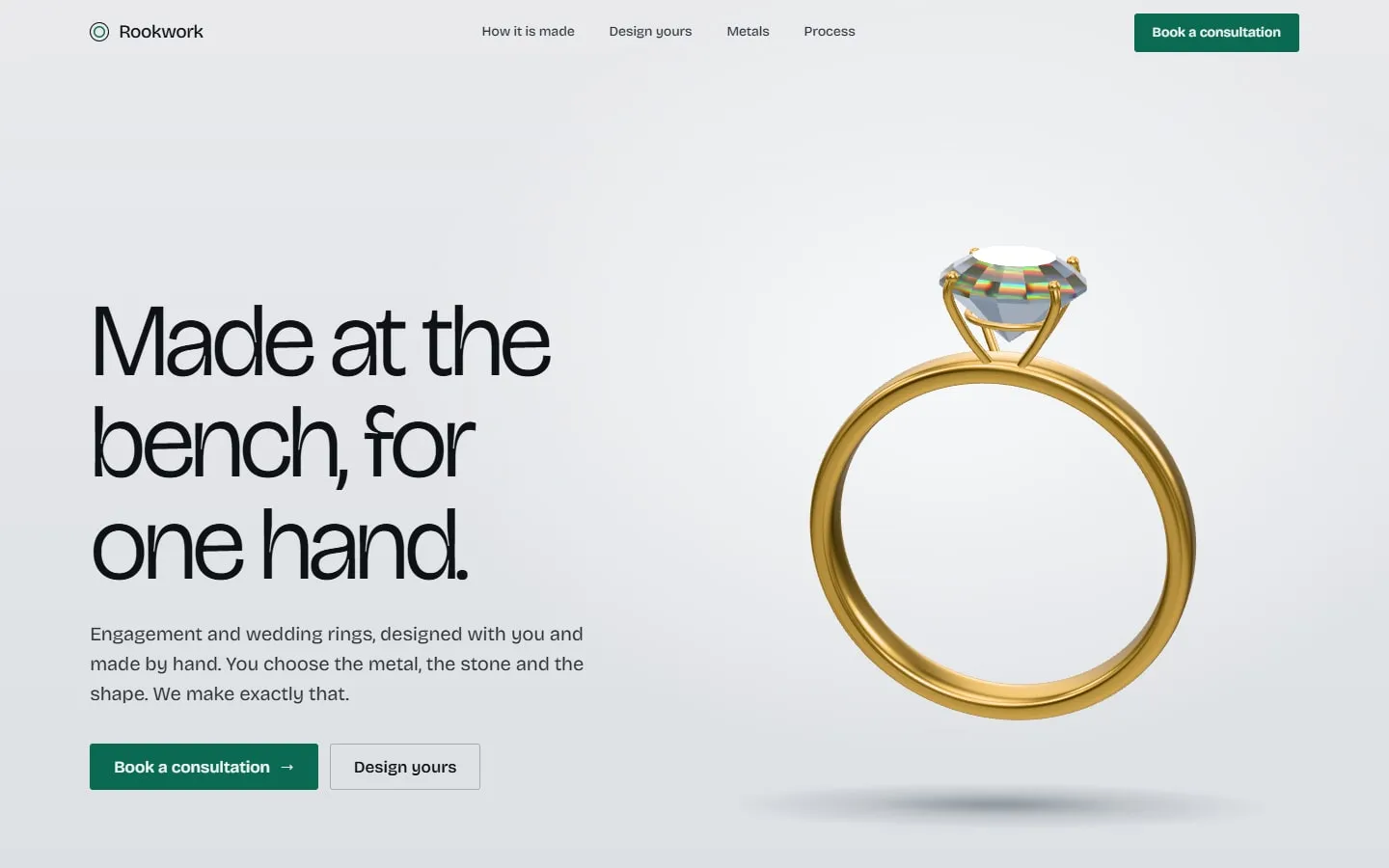 The Rookwork home page: a gold ring with a faceted stone rendered in 3D on a cool grey ground, beside the headline Made at the bench, for one hand